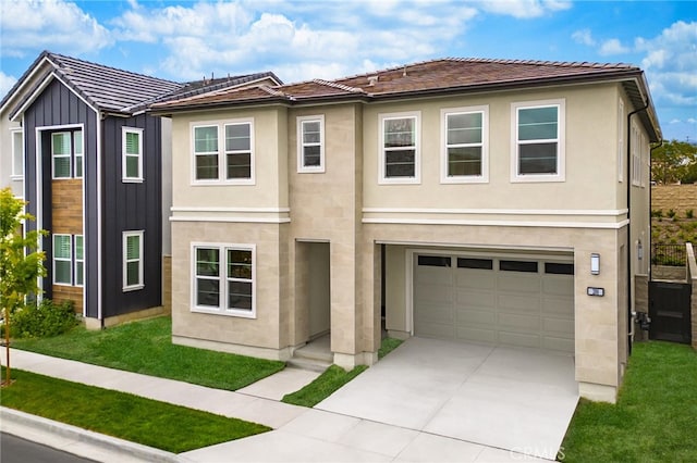 view of front of property with a front lawn and a garage