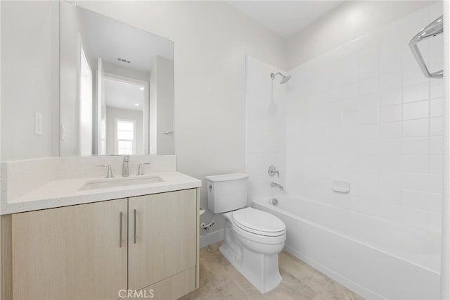 full bathroom with tile floors, toilet, vanity, and tiled shower / bath