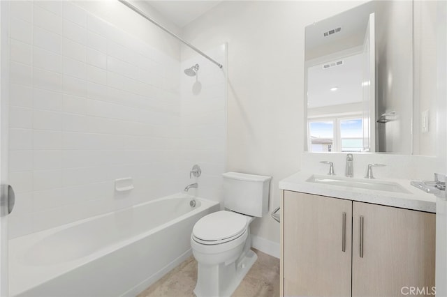 full bathroom featuring toilet, vanity, and tiled shower / bath