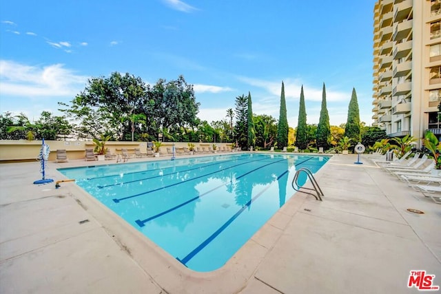 view of pool featuring a patio area