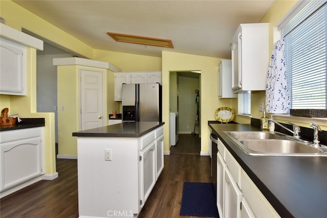 kitchen with white cabinetry, lofted ceiling, stainless steel fridge with ice dispenser, and dark hardwood / wood-style floors