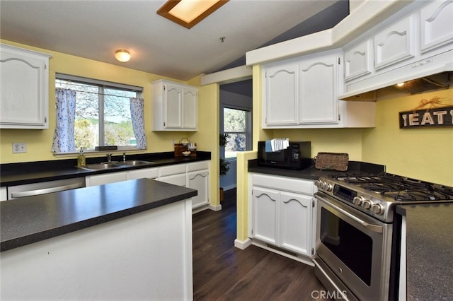 kitchen featuring white cabinetry, appliances with stainless steel finishes, and plenty of natural light