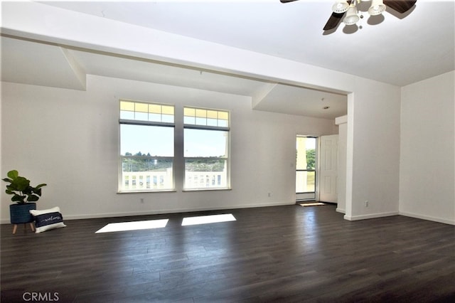 interior space featuring dark wood-type flooring and ceiling fan