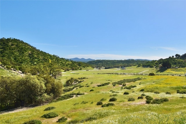 mountain view featuring a rural view