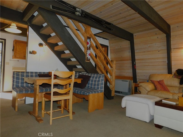 interior space featuring wood walls, wooden ceiling, and beamed ceiling