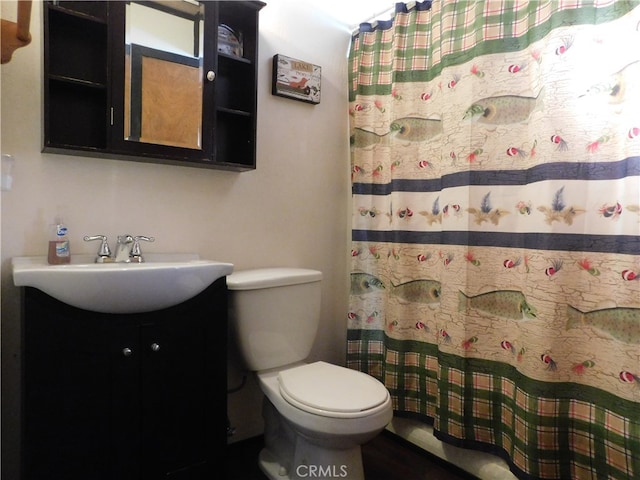 bathroom featuring vanity and toilet