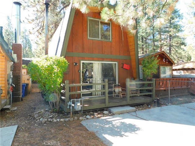 rear view of house with a deck