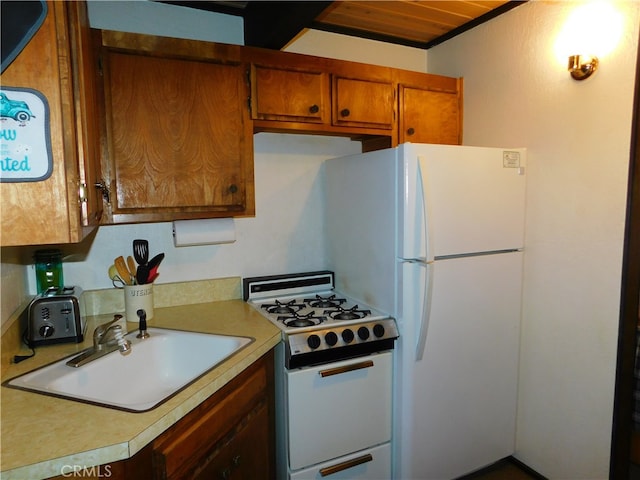 kitchen with white gas range oven and sink