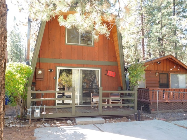 view of front of property with a wooden deck