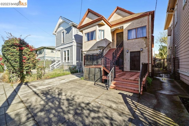 back of property with a patio