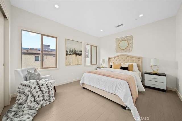 bedroom with light hardwood / wood-style floors