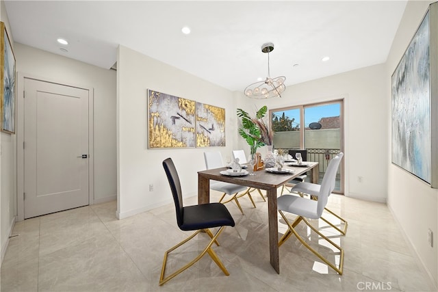 tiled dining space featuring a notable chandelier