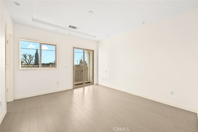 spare room featuring light hardwood / wood-style flooring