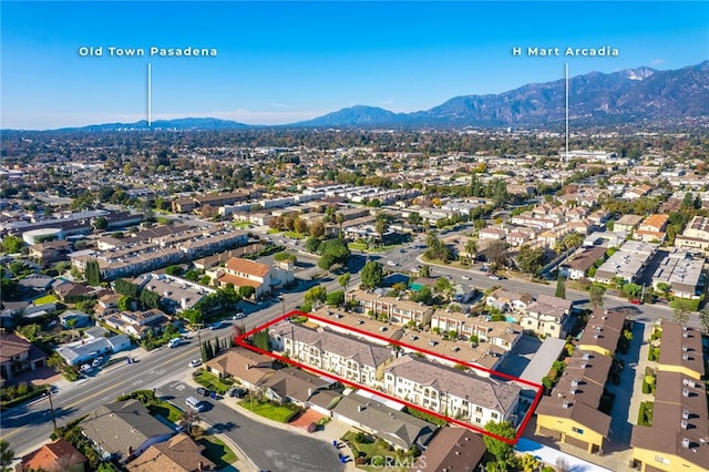 birds eye view of property with a mountain view