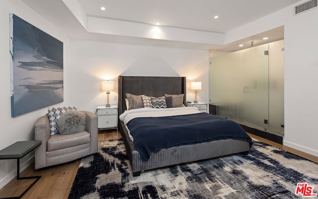 bedroom featuring hardwood / wood-style flooring