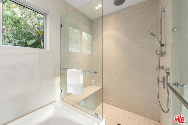 bathroom featuring a shower with shower door