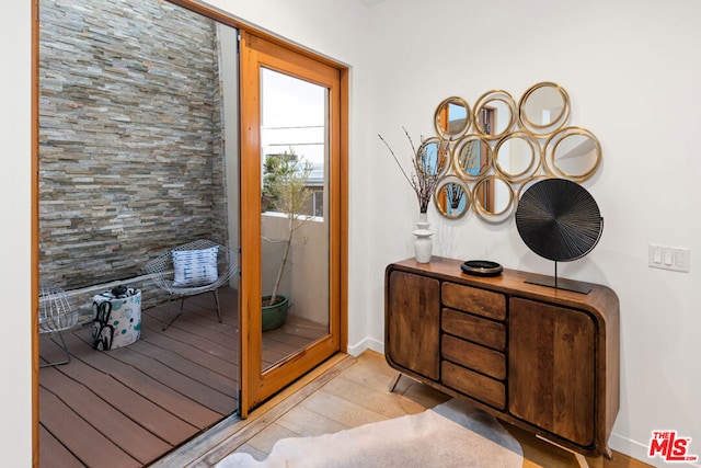 entryway with light hardwood / wood-style floors