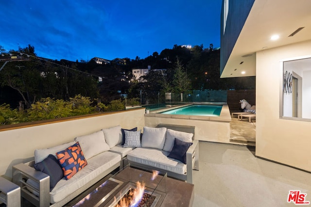 view of swimming pool featuring outdoor lounge area and a patio