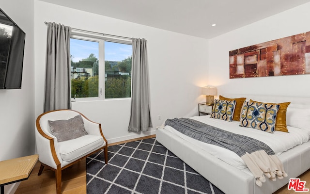 bedroom featuring wood-type flooring