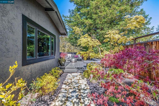 view of yard featuring a wooden deck