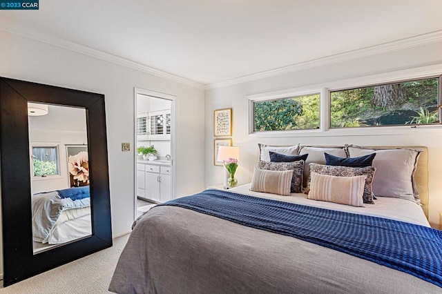 bedroom with light carpet, ensuite bath, ornamental molding, and sink