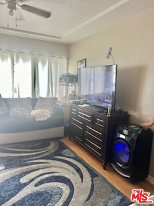 interior space with hardwood / wood-style floors and ceiling fan