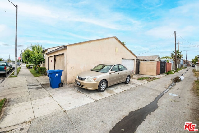 view of side of home with a garage