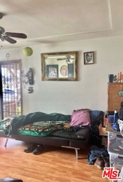 bedroom with hardwood / wood-style flooring and ceiling fan