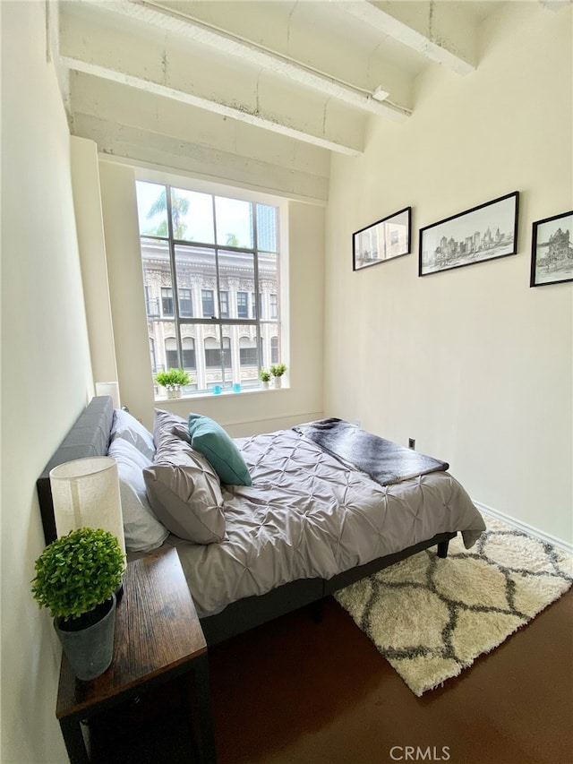 bedroom with beamed ceiling