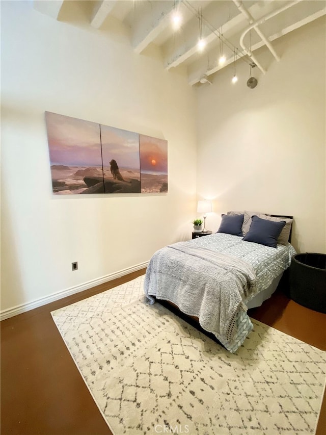 bedroom with beam ceiling