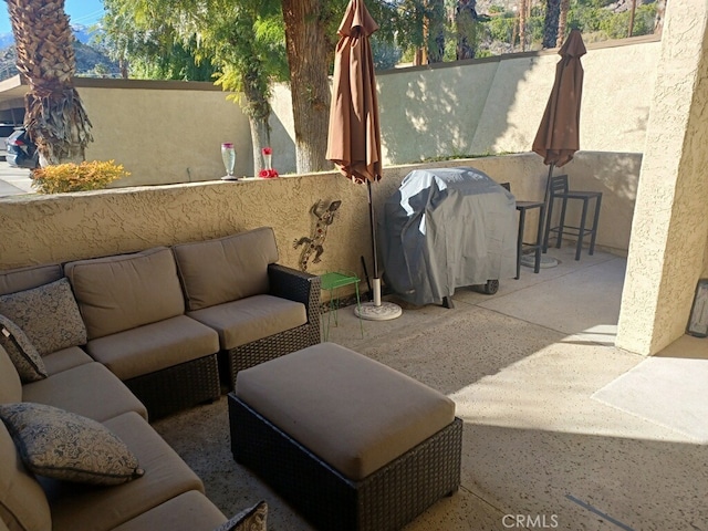 view of patio with a grill and an outdoor living space