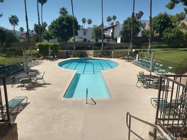 view of pool with a yard and a patio area