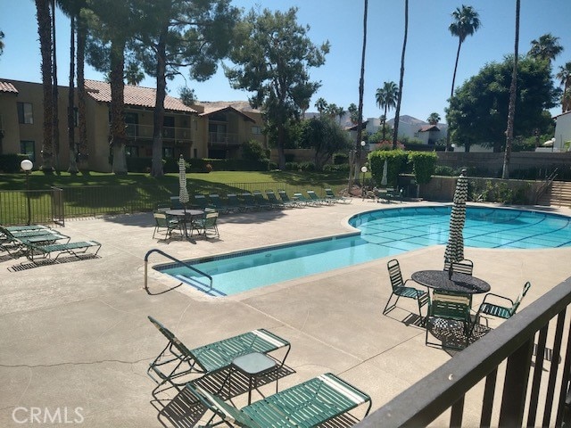 view of swimming pool featuring a patio