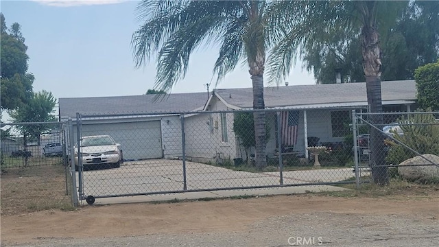 477 County Line Rd, Calimesa, CA 92320 - ranch-style house featuring an attached garage, concrete driveway, and a gate