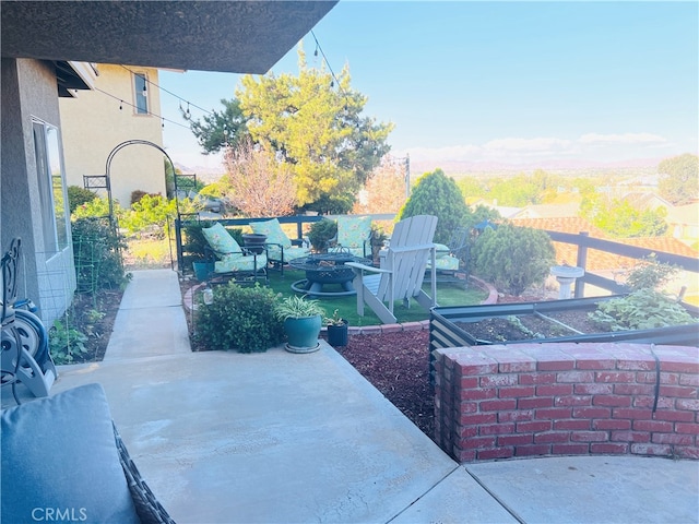 view of patio with a fire pit