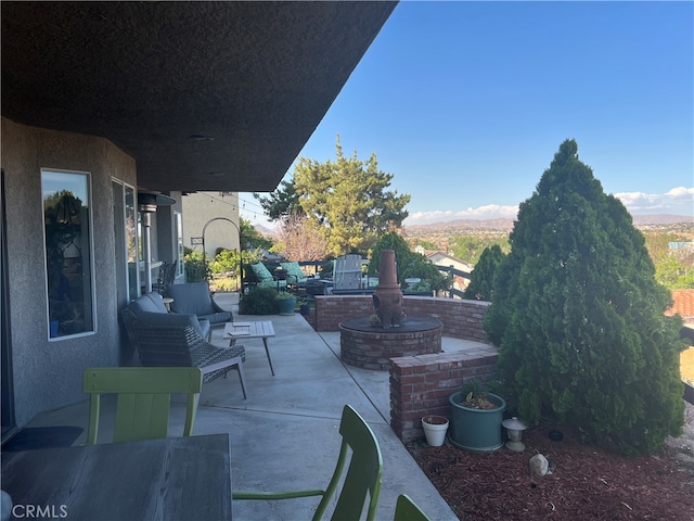 view of patio featuring outdoor lounge area and a mountain view