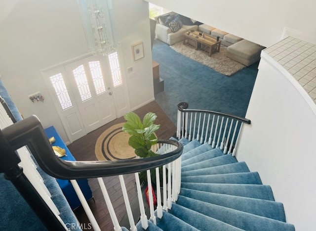 staircase with a high ceiling