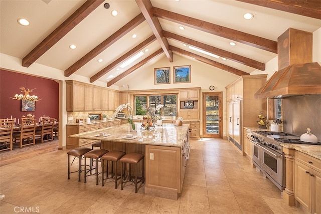 42143 Switzerland Dr, Big Bear, CA 92315 - kitchen with double oven range, island range hood, a breakfast bar, a large island, and decorative backsplash