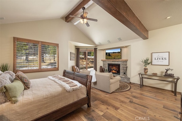 42143 Switzerland Dr, Big Bear, CA 92315 - bedroom featuring hardwood / wood-style flooring, a stone fireplace, and a ceiling fan