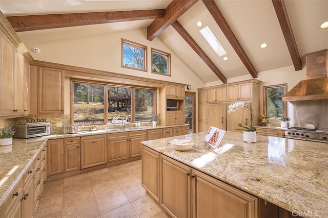 42143 Switzerland Dr, Big Bear, CA 92315 - kitchen featuring tasteful backsplash, wall chimney exhaust hood, light stone counters, beam ceiling, and high vaulted ceiling