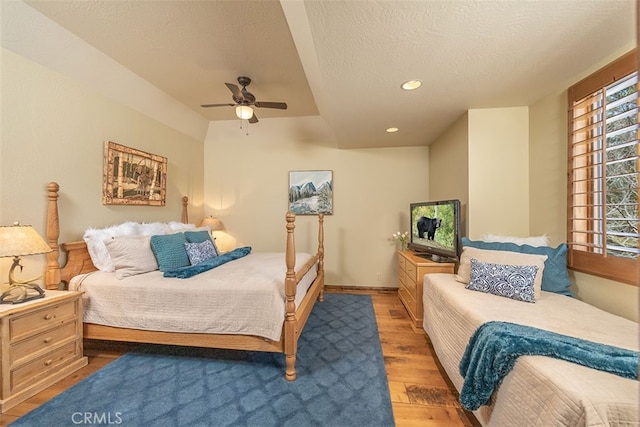 42143 Switzerland Dr, Big Bear, CA 92315 - bedroom with wood finished floors, recessed lighting, a ceiling fan, baseboards, and a textured ceiling