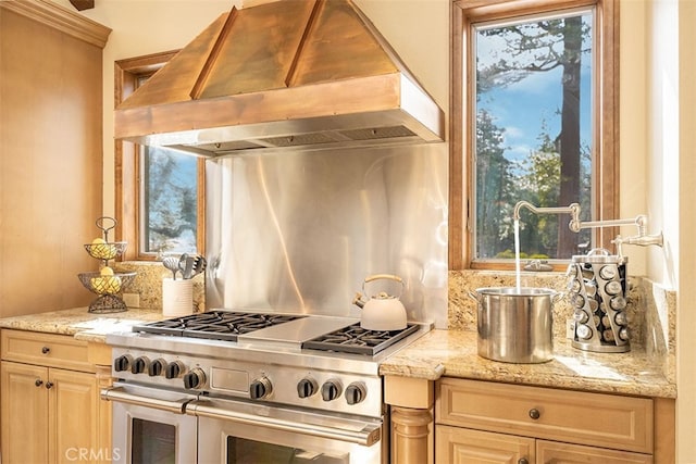 42143 Switzerland Dr, Big Bear, CA 92315 - kitchen with custom range hood, double oven range, tasteful backsplash, and plenty of natural light