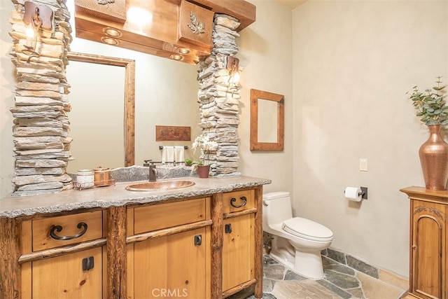 42143 Switzerland Dr, Big Bear, CA 92315 - bathroom featuring stone tile flooring, toilet, and vanity