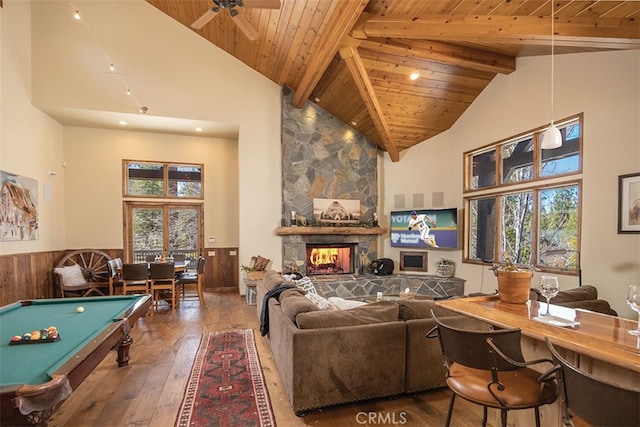 42143 Switzerland Dr, Big Bear, CA 92315 - game room with high vaulted ceiling, wood ceiling, hardwood / wood-style floors, beam ceiling, and a stone fireplace