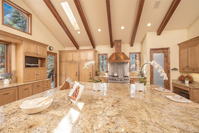 42143 Switzerland Dr, Big Bear, CA 92315 - kitchen featuring high end stainless steel range oven, ventilation hood, light stone countertops, beamed ceiling, and healthy amount of natural light