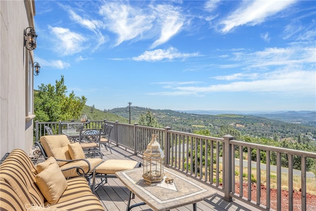 wooden deck with a mountain view