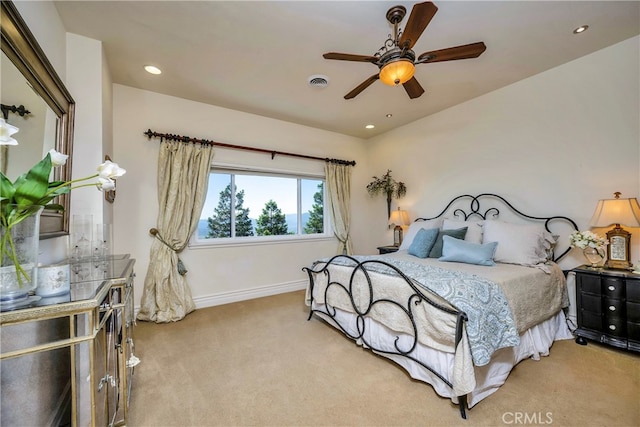 bedroom featuring ceiling fan and light colored carpet