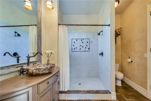 bathroom featuring vanity, toilet, and a shower with shower curtain