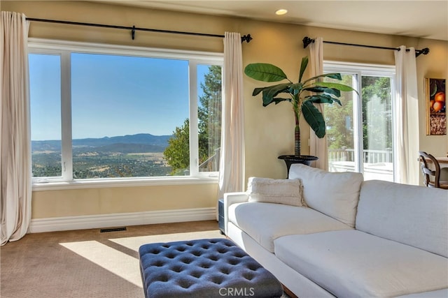 interior space with a mountain view and a healthy amount of sunlight