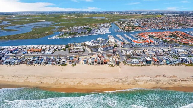 bird's eye view featuring a beach view and a water view